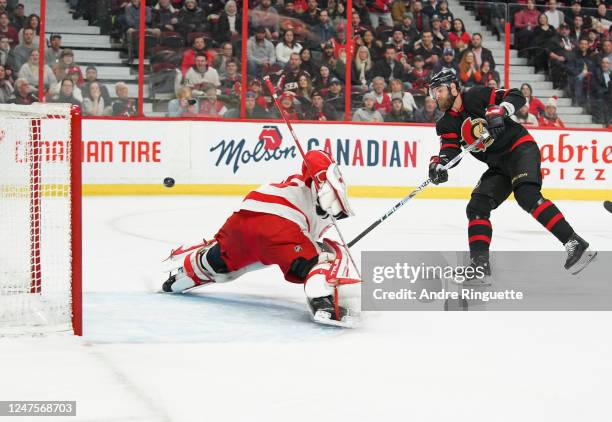 Austin Watson of the Ottawa Senators scores a first period goal against Ville Husso of the Detroit Red Wings at Canadian Tire Centre on February 28,...