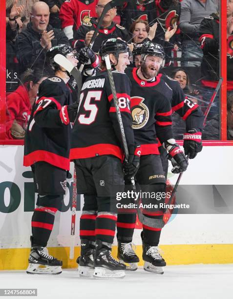 Austin Watson of the Ottawa Senators celebrates his first period goal against the Detroit Red Wings with teammates at Canadian Tire Centre on...