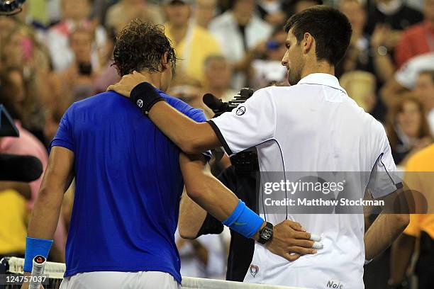 Rafael Nadal of Spain congratulates Novak Djokovic of Serbia after Djokovic won the Men's Final on Day Fifteen of the 2011 US Open at the USTA Billie...