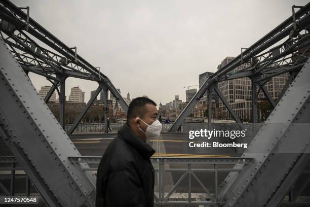 Pedestrians on the Garden Bridge near the Bund in Shanghai, China, on Tuesday, Feb. 28, 2023. After three years of turbulence under the Covid...