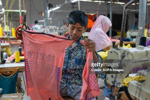 Kid is seen working in a local ready-made garment factory. Child labour is restricted in ready-made garment sectors. However, there are still...