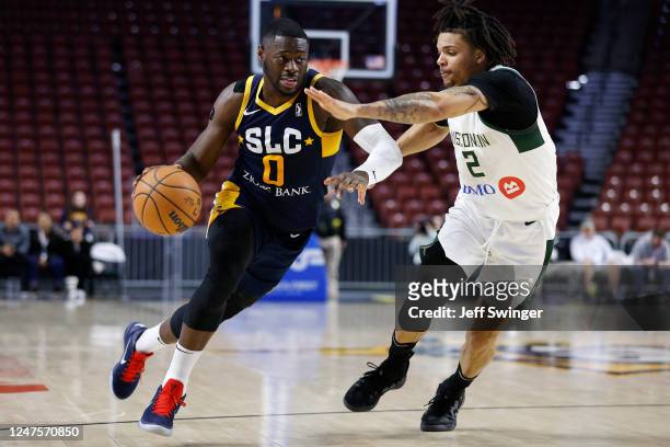 February 28: Rawle Alkins of the Salt Lake City Stars drives against Rob Edwards of the Wisconsin Herd at the Maverick Center on February 28, 2023 in...