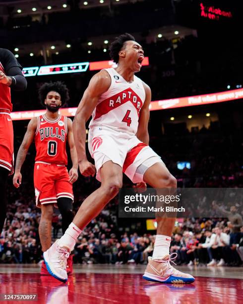 Scottie Barnes of the Toronto Raptors celebrates against the Chicago Bulls during the second half of their basketball game at the Scotiabank Arena on...