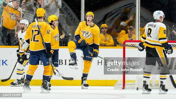 Mark Jankowski of the Nashville Predators celebrates his goal with Luke Evangelista and Zach Sanford against the Pittsburgh Penguins during an NHL...