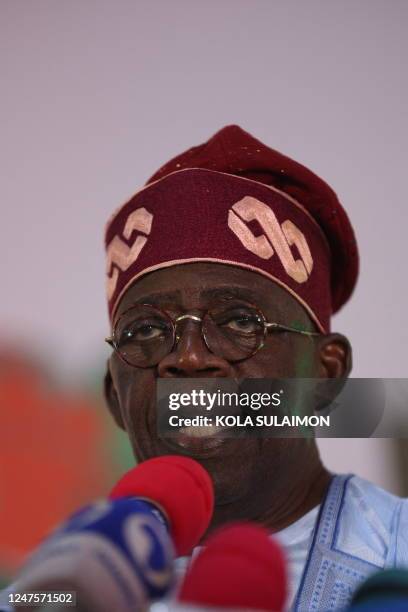 Ruling party candidate Bola Tinubu, addresses supporters in Abuja on March 1, 2023 during celebrations at his campaign headquarters. - Ruling party...