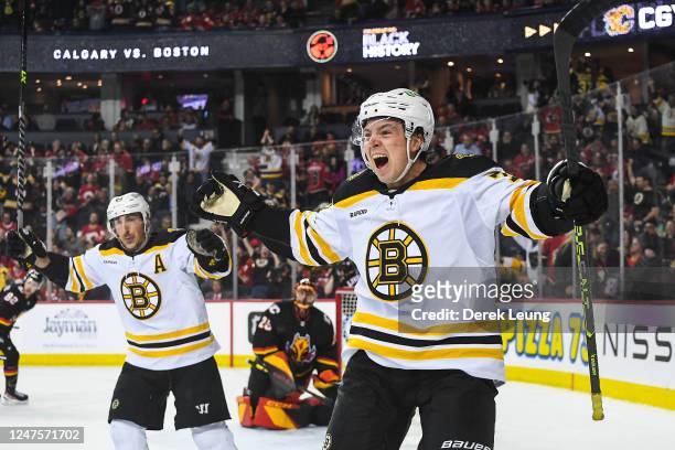 Charlie McAvoy of the Boston Bruins celebrates after scoring the game-winning goal against the Calgary Flames during the overtime period of an NHL...