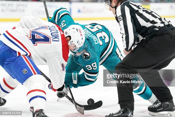 Logan Couture of the San Jose Sharks takes a face-off against Nick Suzuki of the Montreal Canadiens at SAP Center on February 28, 2023 in San Jose,...