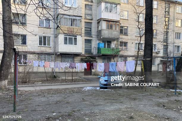Picture shows laundry drying outside the building hosting the Refugee Accommodation Center of Nisporeni, near Chisinau, on February 6, 2023. - 57...