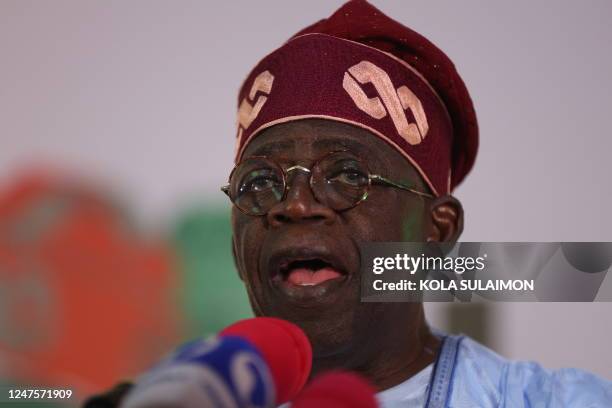 Ruling party candidate Bola Tinubu, looks on in Abuja on March 1, 2023 during celebrations at his campaign headquarters. - Ruling party candidate...