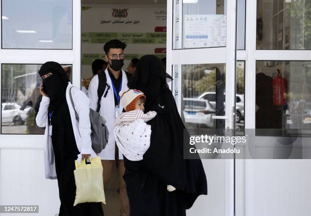 Mother, holding her child, is seen at Sabeen Hospital where Yemeni children, suffering from malnutrition, receive treatment with limited resources in...