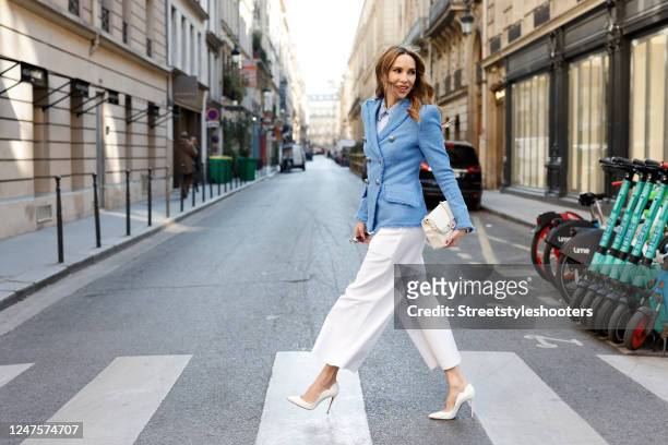 Alexandra Lapp is seen wearing MAISON COMMON double breasted tweed blazer in deep blue, MAISON COMMON striped blouse with flower collar in light...