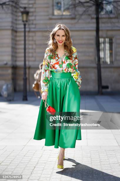 Alexandra Lapp is seen wearing ODEEH blouse, C.WIRSCHKE green satin skirt, CHRISTIAN LOUBOUTIN Hot Chick pumps in yellow, HERMES Kelly bag during a...