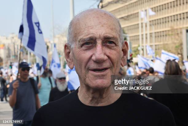Former Israeli prime minister Ehud Olmert attends a demonstration against the Israeli government's controversial justice reform bill, in Tel Aviv on...