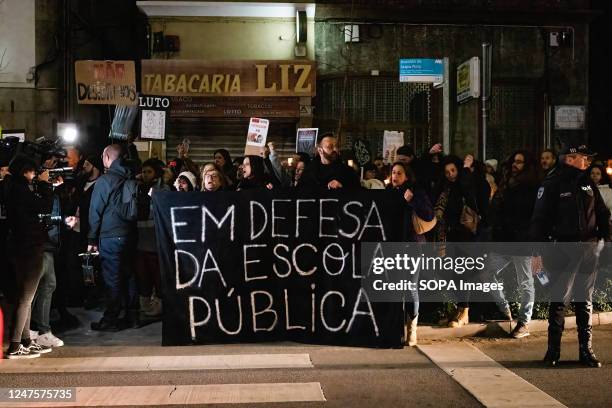 Teachers hold a banner saying "em defesa da escola pblica" during the demonstration. Teachers demonstrated for their right to fight for better...