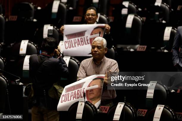 February 28 Mexico City, Mexico: The legislators of the work parties and the national regeneration movement show blankets with photographs of Felipe...