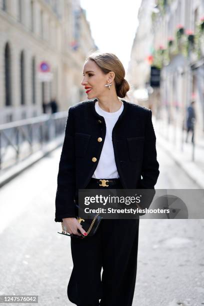 Alexandra Lapp is seen wearing ROSSI pants in black, CELINE bag, CELINE belt in black, CELINE trainer low lace-up loafer, MASSIMO DUTTI t-shirt,...