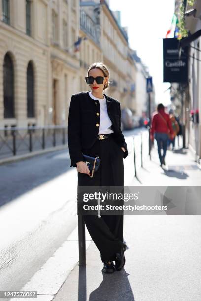 Alexandra Lapp is seen wearing ROSSI pants in black, CELINE bag, CELINE belt in black, CELINE trainer low lace-up loafer, MASSIMO DUTTI t-shirt,...