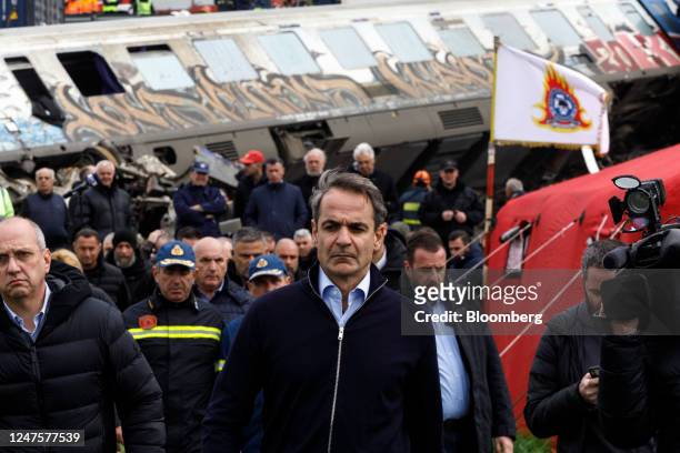 Kyriakos Mitsotakis, Greece's prime minister, center, visits the site of a train crash in the Tempe valley near Larissa, Greece, on Wednesday, March...