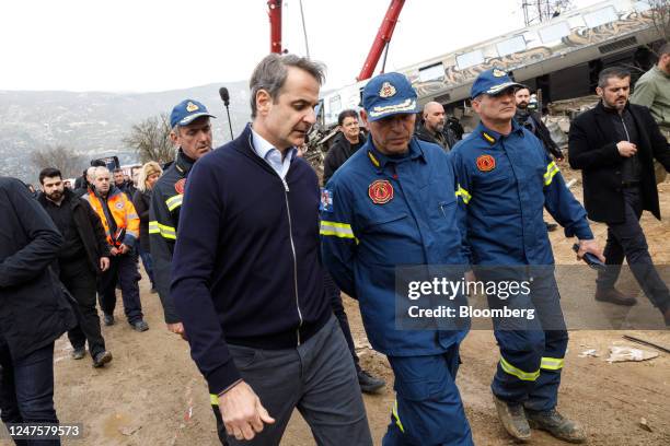 Kyriakos Mitsotakis, Greece's prime minister, center, tours the site of a train crash in the Tempe valley near Larissa, Greece, on Wednesday, March...