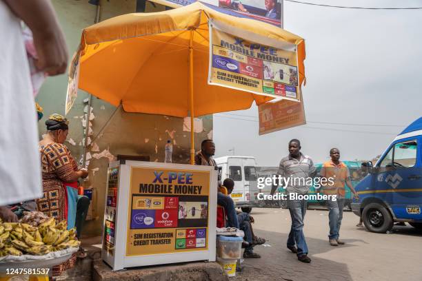 Mobile money and sim card kiosk in Accra, Ghana, on Tuesday, Feb. 28, 2023. Ghanas cedi, the worlds second-worst performing currency this year, is...