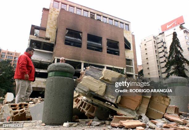 Rescue staff search the debris 08 February, 2003 after a powerful car bomb exploded in a popular night club, El Nogal, frequented by politicians and...