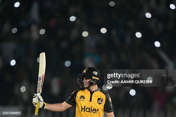 Peshawar Zalmi's Tom Kohler-Cadmore celebrates after scoring half century during the Pakistan Super League T20 cricket match between Karachi Kings...