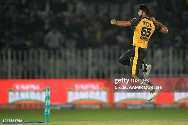 Peshawar Zalmi's Aamer Jamal celebrates after taking the wicket of Karachi Kings' Tabraiz Shamsi during the Pakistan Super League T20 cricket match...