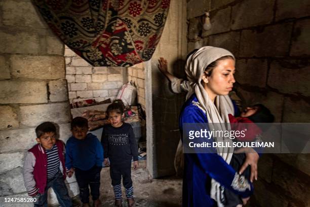 Displaced Syrians living in war-damaged buildings, are pictured in Syria's rebel-held northern city of Raqa on March 1 amid fears that the already...