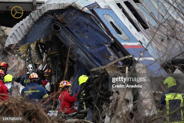 Rescuers operate next to debris of a train, after a crash near the city of Larissa, Greece, on March 1, 2023. At least 36 were killed when a...