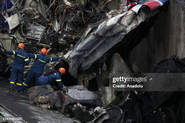 Rescuers operate next to debris of a train, after a crash near the city of Larissa, Greece, on March 1, 2023. At least 36 were killed when a...