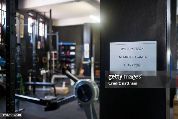 covid signage in a gym - gym reopening stock pictures, royalty-free photos & images
