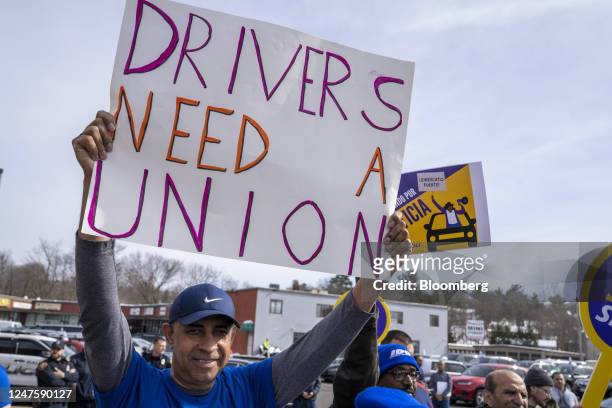 Uber and Lyft drivers rally to unionize in front of a local Uber Greenlight office in Saugus, Massachusetts, US, on Wednesday, March 1, 2023. Drivers...