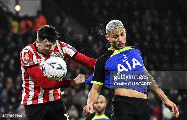 Sheffield United's Bosnian defender Anel Ahmedhodzic fights for the ball with Tottenham Hotspur's Brazilian striker Richarlison during the FA Cup...