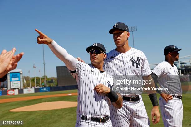 Gleyber Torres and Aaron Judge of the New York Yankees look on before a spring training game against the Atlanta Braves at George M. Steinbrenner...