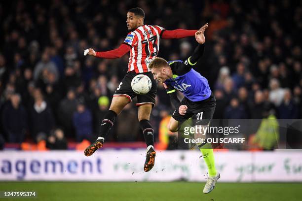 Sheffield United's English defender Max Lowe fights for the ball with Tottenham Hotspur's Swedish midfielder Dejan Kulusevski during the FA Cup fifth...