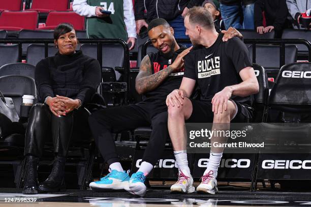 Damian Lillard of the Portland Trail Blazers, Joe Ingles of the Milwaukee Bucks, and Tina Thompson talk before the game on February 6, 2023 at the...