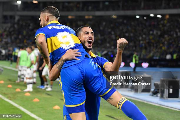 Darío Benedetto of Boca Juniors celebrates with teammate Jorge Figal after scoring the team's first goal during the final match of the Supercopa...