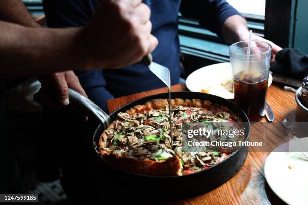 Serving up a deep dish pizza at Pizzeria Uno in Chicago in 2009. Pizzeria Uno, owned by Uno Restaurant Holdings Corp., announced it is selling its...