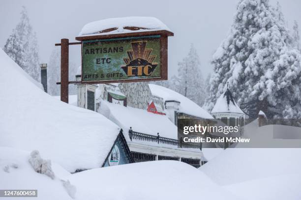 Snow deepens as residents throughout the San Bernardino Mountains remain trapped in their homes on March 1, 2023 in Running Springs, California. San...