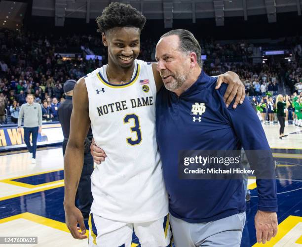 Trey Wertz and retiring head coach Mike Brey of the Notre Dame Fighting Irish walk off of Notre Dames court for the final time following the game...