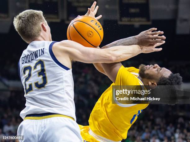 Dane Goodwin of the Notre Dame Fighting Irish defends against the shot from Nelly Cummings of the Pittsburgh Panthers during the second half at Joyce...