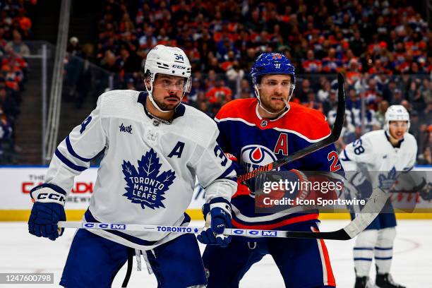 Edmonton Oilers Center Leon Draisaitl and Toronto Maple Leafs Center Auston Matthews battle for position in the first period of the Edmonton Oilers...