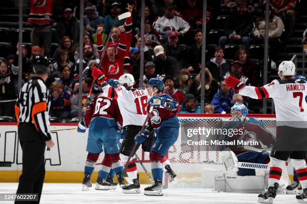 Ondrej Palat and Dougie Hamilton of the New Jersey Devils celebrate a goal against the Colorado Avalanche at Ball Arena on March 1, 2022 in Denver,...