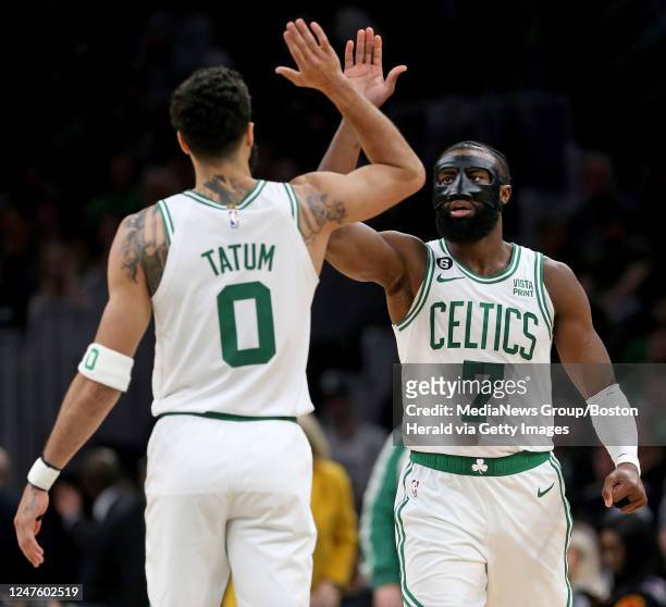 Jayson Tatum of the Boston Celtics celebrates with Jaylen Brown during the second half of the NBA game against the Cleveland Cavaliers at the TD...