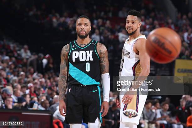 Damian Lillard of the Portland Trail Blazers and CJ McCollum of the New Orleans Pelicans look on during the game on March 1, 2023 at the Moda Center...