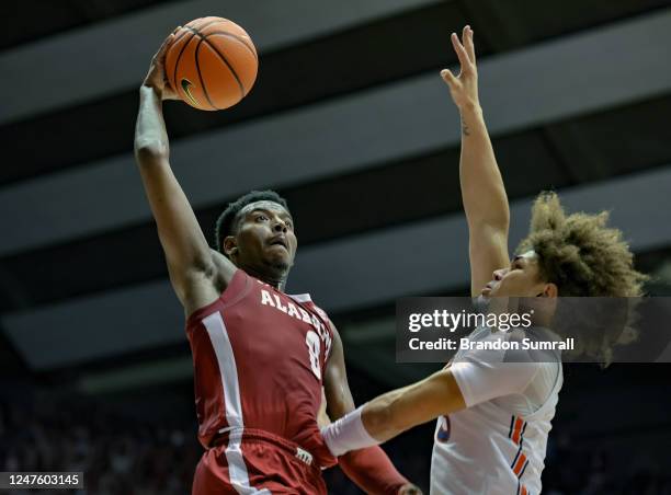 Jaden Bradley of the Alabama Crimson Tide drives to the basket during the second half against Tre Donaldson of the Auburn Tigers at Coleman Coliseum...