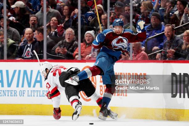 Michael McLeod of the New Jersey Devils collides with Artturi Lehkonen of the Colorado Avalanche at Ball Arena on March 1, 2022 in Denver, Colorado.
