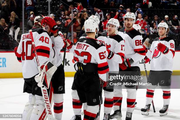 Members of the New Jersey Devils celebrate a victory against the Colorado Avalanche at Ball Arena on March 1, 2022 in Denver, Colorado. The Devils...