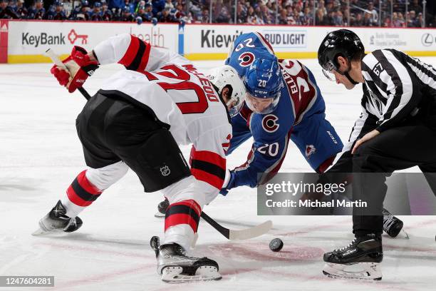 Michael McLeod of the New Jersey Devils faces off against Lars Eller of the Colorado Avalanche at Ball Arena on March 1, 2022 in Denver, Colorado....