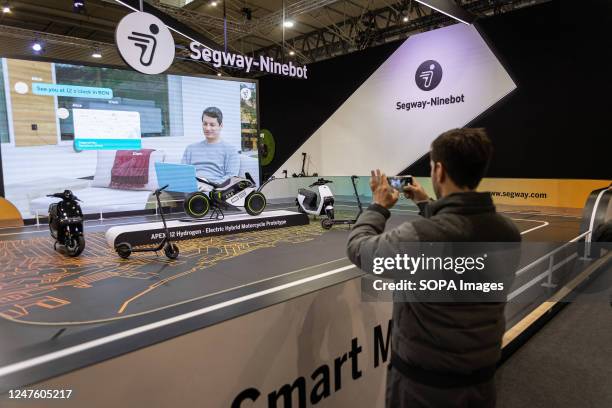 Visitor of the Mobile World Congress taking a picture of the newest vehicle models from Segway-Ninebot company. The Mobile World Congress Barcelona...